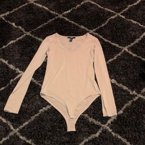 Tan along sleeve body suit